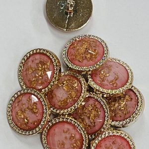 Auksinė, plastikinė saga rožiniu viduriuku, apipinta grandinėle, 21mm, 1vnt 03510